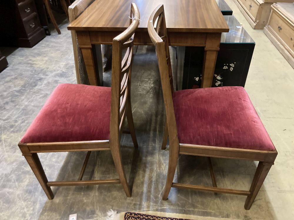 A Swedish dining table and four chairs, table 270cm extended (two spare leaves) width 80cm height 74cm